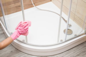 How do professional cleaners clean showers?